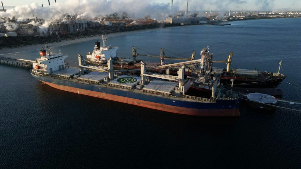 Geared bulk carriers at port, aerial view